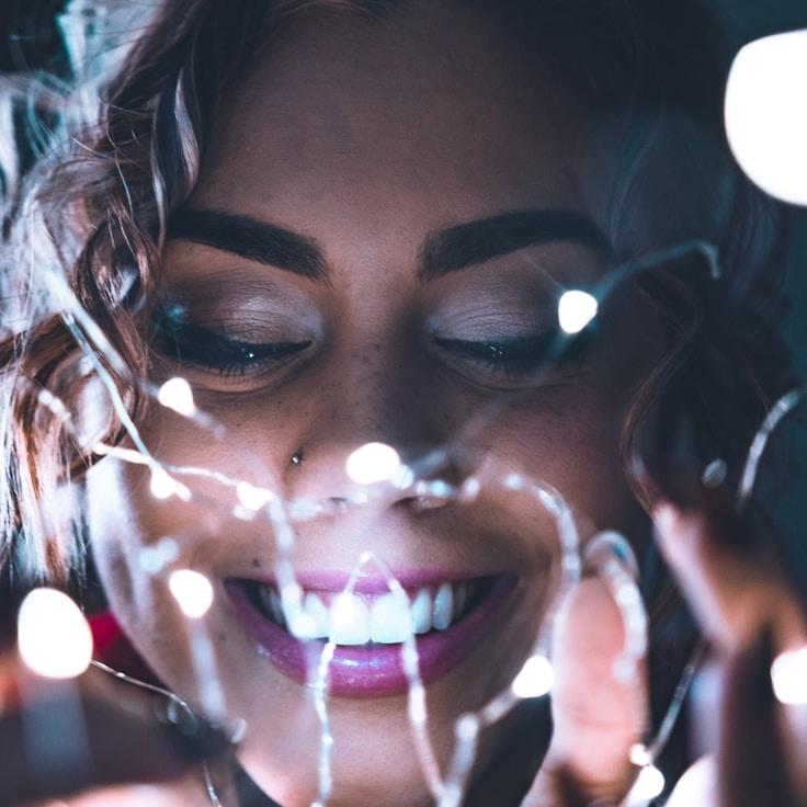 Kaveri Mehta, Lead Design Curator at Subtle River Glow, reviewing corporate floral arrangements